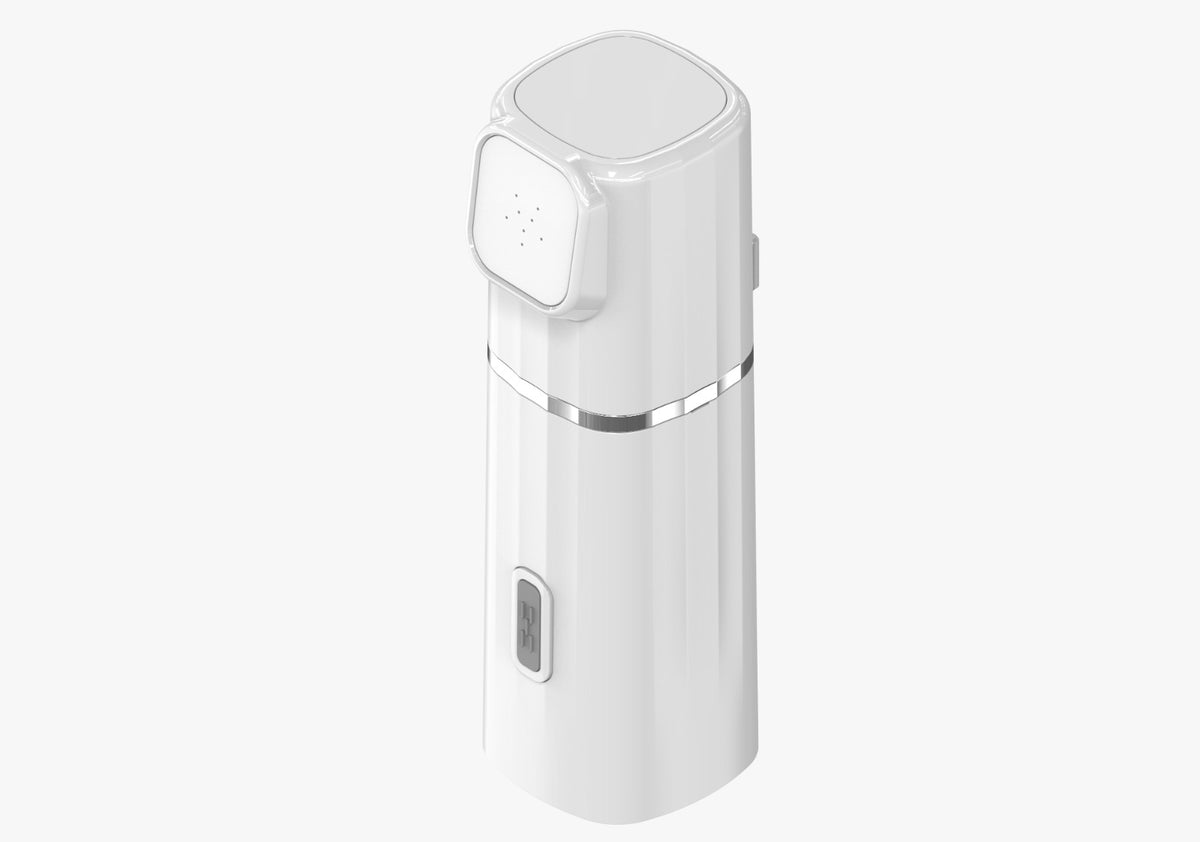 Three-quarter close-up of the white Anawnas Pro5 handheld bidet, showing its spray nozzle, power button and silver trim.